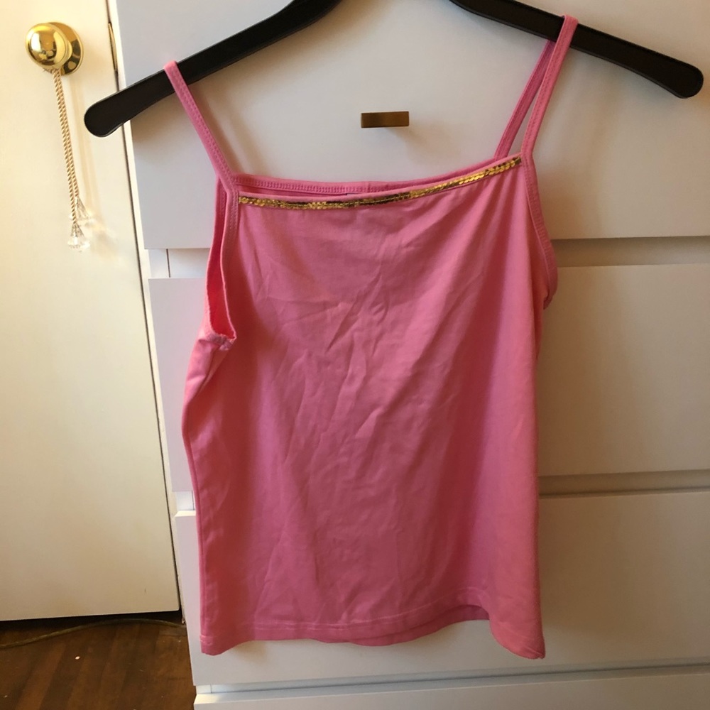 Spaghetti strap shirt with a gold design.